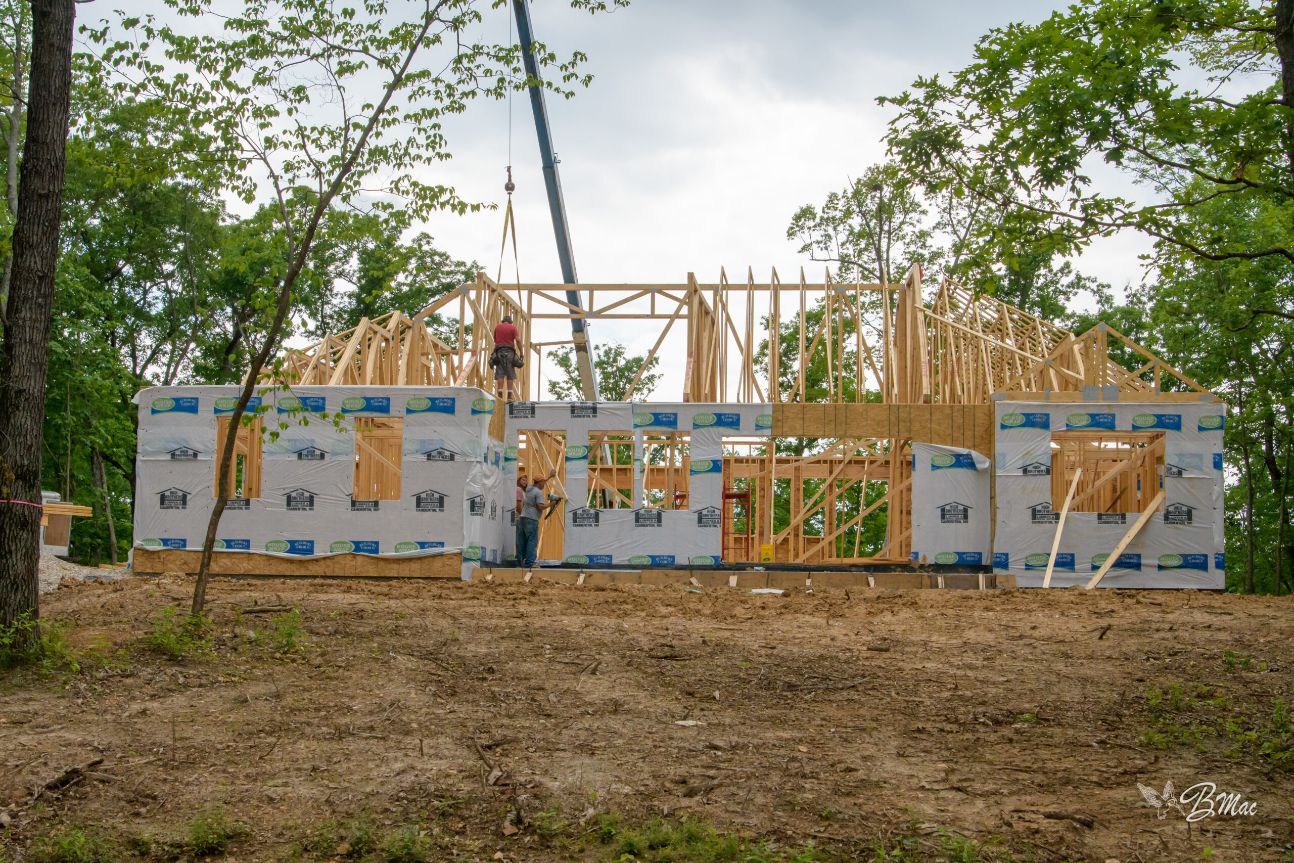 Crane truck staging at a Cloke Custom Homes framing build site