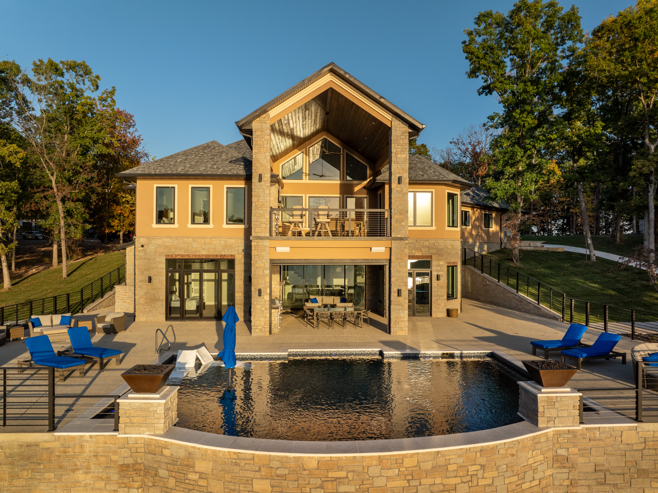 Custom lakefront stone home with infinity pool at Lake of the Ozarks