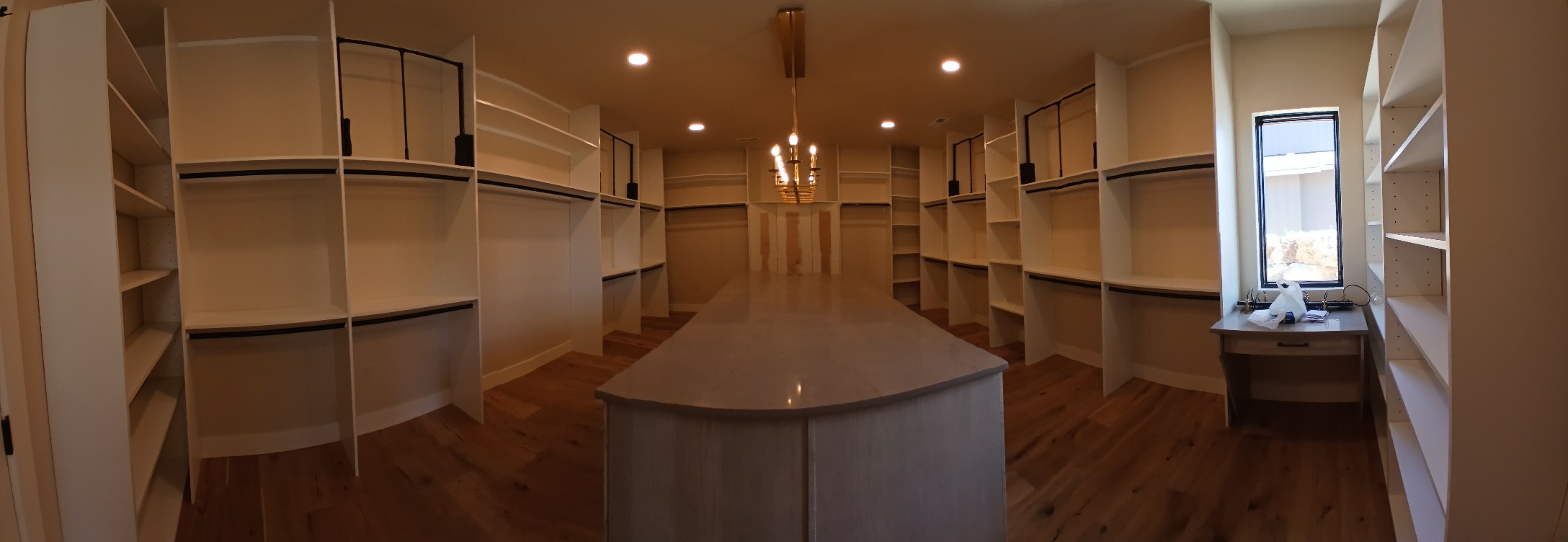 Custom walk-in closet with center island and built-in shelving, Cloke Custom Homes