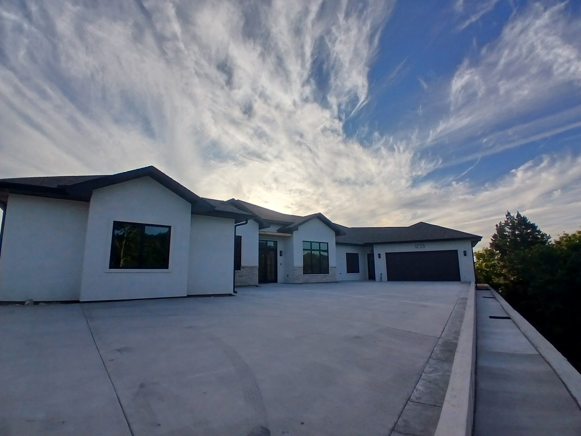 Single-level modern lakeside ranch custom home exterior by Cloke Custom Homes